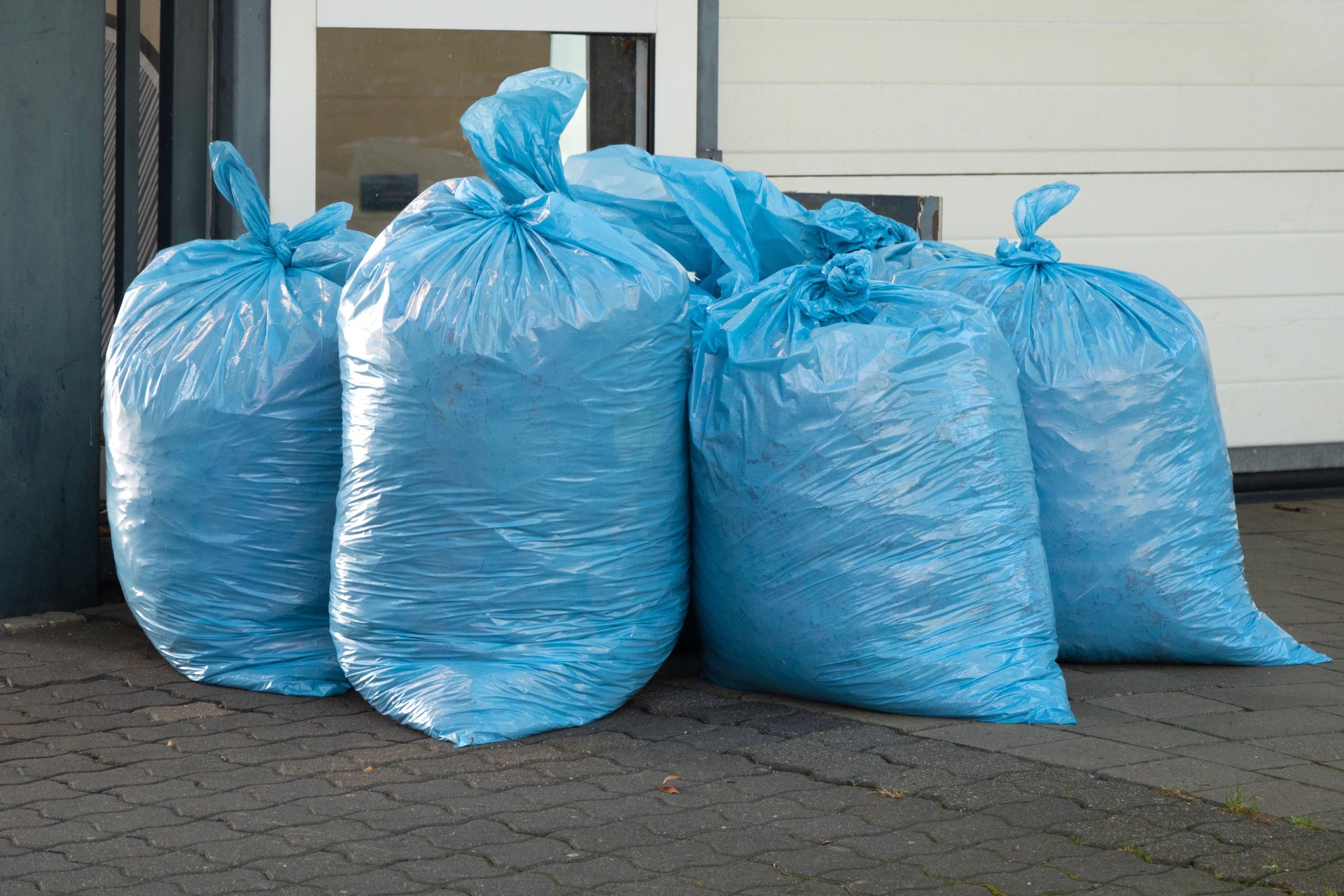 Blue garbage bags filled with garbage